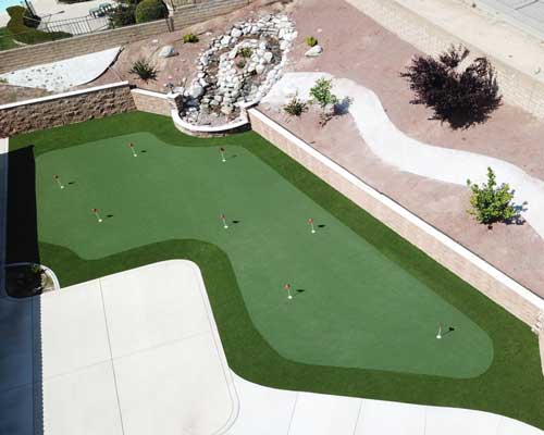 Backyard putting green installation showing custom shape and practice layout