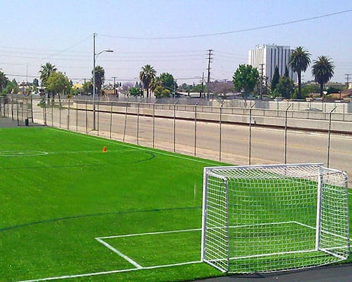 Synthetic turf soccer field installation
