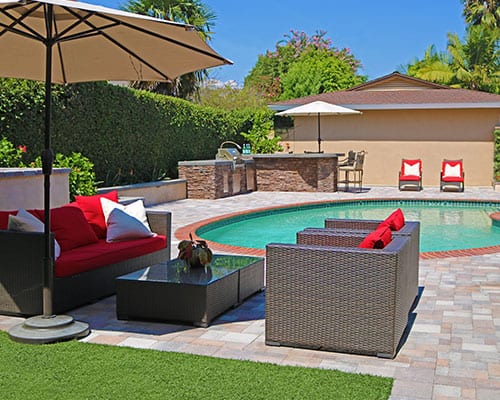 Outdoor living space around pool